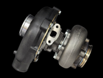BL-5757 Turbocharger shown at an angle, compressor housing and turbine wheel side visible, exhaust flange with studs exposed