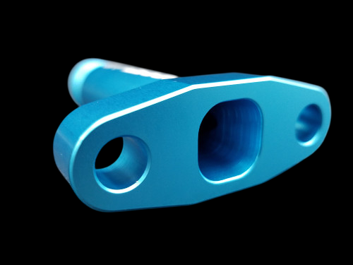 Teal anodized billet T3/T4 turbo oil drain flange, angled view showing -10 AN fitting and mounting holes