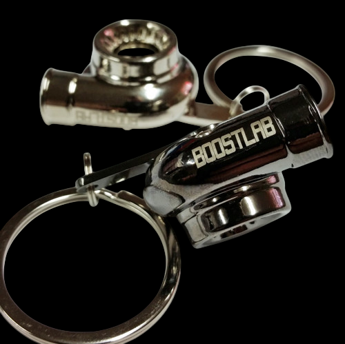 Boost Lab Turbo Key Chain, chrome turbo shape with split ring, close angled view showing BOOSTLAB text