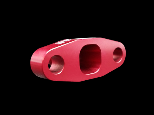 Red anodized billet T3/T4 turbo oil drain flange, angled view showing two round holes and one square port.