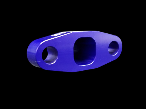 Purple anodized BL billet T3/T4 turbo oil drain flange, angled top view showing three machined ports
